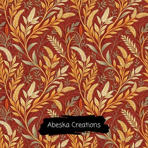 May include: A repeating pattern featuring golden wheat stalks and green leaves set against a deep red background. The design includes the text Abeska Creations printed in white letters over a black brushstroke shape at the bottom center.