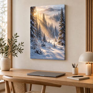 May include: A vertical rectangular canvas print depicting a snow-covered forest landscape at sunrise. Tall evergreen trees are blanketed in white snow, with golden sunlight filtering through the mist and casting long shadows across the terrain.
