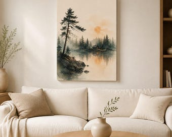 May include: A rectangular wall art print featuring a watercolour landscape of a calm lake surrounded by a dense pine forest. A small cabin sits near the water edge under a soft orange sun. The scene includes rocky terrain and reflections.