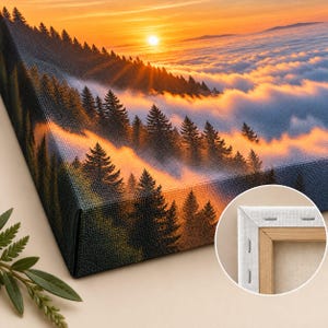 May include: A rectangular canvas print featuring a landscape of dark green pine trees emerging from a thick layer of clouds at sunset. The sky is filled with orange and yellow light. The back shows a wooden frame with white canvas stapled edges.