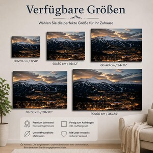 May include: A wall art display featuring five rectangular canvas prints of a snowy mountain landscape at sunset over a town. The prints are labeled with sizes: 12x8, 16x12, 24x16, 28x20, and 36x24 inches. Text includes 'Verf&uuml;gbare Gr&ouml;&szlig;en' and 'W&auml;hlen Sie die perfekte Gr&ouml;&szlig;e f&uuml;r Ihr Zuhause'.