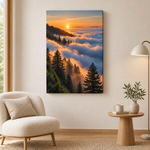 May include: A rectangular wall art print featuring a landscape of evergreen trees on a mountainside during sunset. The scene shows a bright orange sun glowing above a thick layer of clouds that blankets the valley below the dark green forest.
