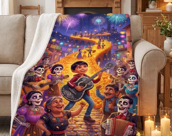 May include: A plush throw blanket featuring a vibrant scene of a boy playing a guitar surrounded by skeleton figures in colourful clothing, set on a cobblestone path with marigold petals, festive lanterns, and fireworks in the night sky.