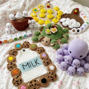 May include: A collection of crocheted items including a brown mug with white marshmallows, a green turtle, a brown turkey, a purple octopus, a white milk carton with the word MILK, and various small colorful cookies and round plush shapes.