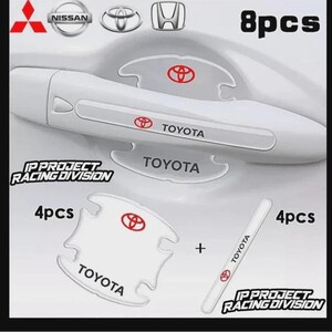 Könnte beinhalten: Ein 8-teiliges Set aus transparenten Schutzaufklebern für Autotürgriffe mit dem roten Toyota-Logo und dem schwarzen Schriftzug TOYOTA. Das Set enthält 4 konturierte Griffschalen-Schutzfolien und 4 rechteckige Schutzstreifen für die Türgriffe.