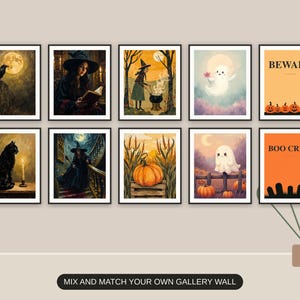 Ten Halloween prints from the bundle framed together as a gallery wall above a console table