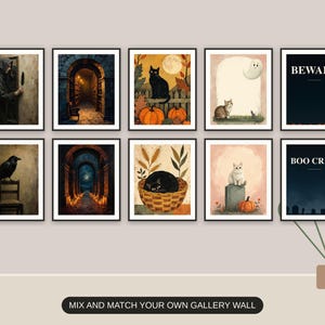 Ten Halloween prints from the bundle framed together as a gallery wall above a console table