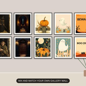 Ten Halloween prints from the bundle framed together as a gallery wall above a console table