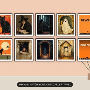 Ten Halloween prints from the bundle framed together as a gallery wall above a console table