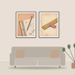 vintage classroom objects printable art framed above a sofa in a styled living room