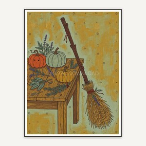 Witch broom against wooden table with pumpkins and herbs