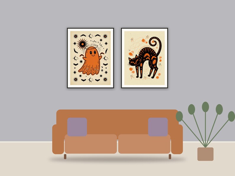 halloween decor printable art framed above a sofa in a styled living room