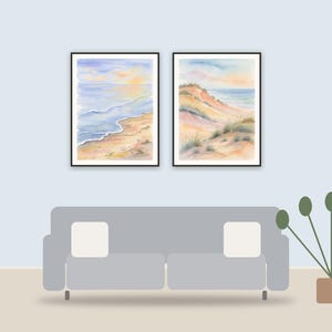 coastal vintage prints printable art framed above a sofa in a styled living room
