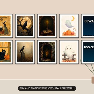 Ten Halloween prints from the bundle framed together as a gallery wall above a console table