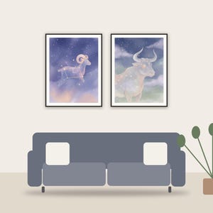 zodiac celestial art printable art framed above a sofa in a styled living room