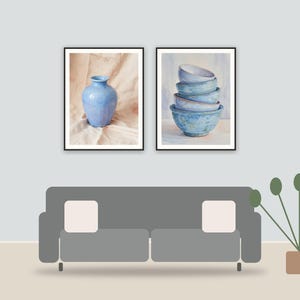 patina blue ceramic studies printable art framed above a sofa in a styled living room