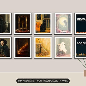 Ten Halloween prints from the bundle framed together as a gallery wall above a console table