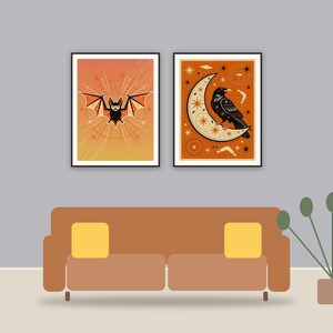 halloween decor and spooky season wall art printable art framed above a sofa in a styled living room