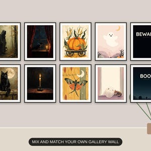 Ten Halloween prints from the bundle framed together as a gallery wall above a console table