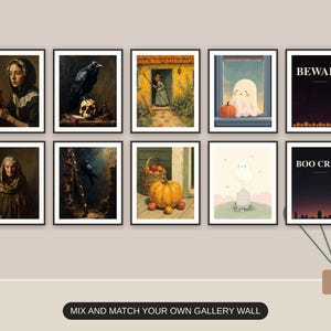 Ten Halloween prints from the bundle framed together as a gallery wall above a console table