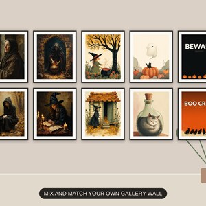 Ten Halloween prints from the bundle framed together as a gallery wall above a console table