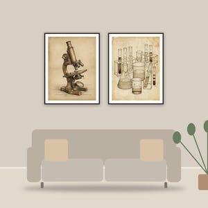 vintage science lab icons printable art framed above a sofa in a styled living room