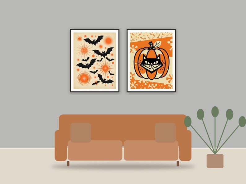 halloween decor printable art framed above a sofa in a styled living room