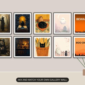 Ten Halloween prints from the bundle framed together as a gallery wall above a console table