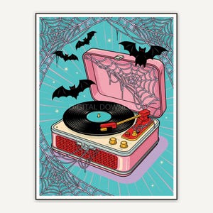 Spider web over record player with bats