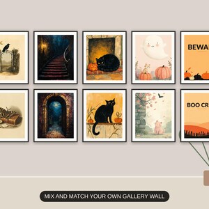 Ten Halloween prints from the bundle framed together as a gallery wall above a console table