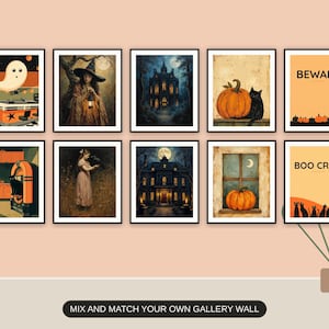 Ten Halloween prints from the bundle framed together as a gallery wall above a console table