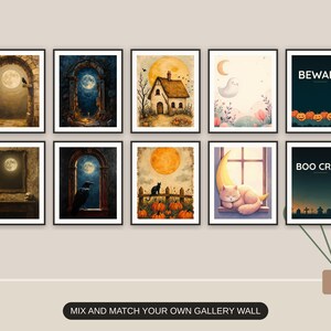Ten Halloween prints from the bundle framed together as a gallery wall above a console table