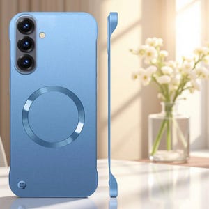 May include: A light blue smartphone case featuring a circular magnetic ring on the back, a vertical camera cutout with three lens openings, and a small oval port at the bottom. The case is shown from both the back and a thin side profile view.