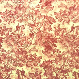 May include: A repeating pattern featuring a hunting scene in a toile de Jouy style. The design is in shades of red and cream, depicting riders on horseback, dogs, and foliage. The overall theme is classic and traditional.