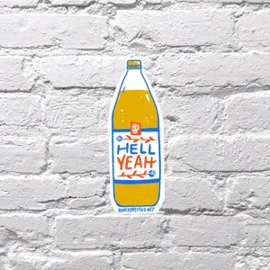 May include: A yellow and orange sticker of a cartoon bottle with a blue label that says "HELL YEAH" and a skull graphic. The sticker has a white outline and the text "BENCHPRESSED.NET" at the bottom.