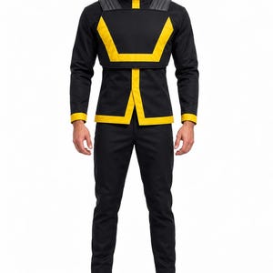 May include: A black long-sleeved jacket with a high collar and yellow trim, featuring a structured chest overlay with yellow accents, paired with matching black trousers and black boots. The jacket has a vertical yellow stripe on the collar.