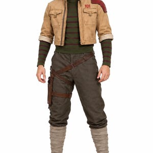 May include: A tan cropped jacket with a red shoulder patch and the number 101, worn over a dark green shirt with horizontal stripes. The outfit includes dark olive trousers with a brown leather holster belt and light tan leg wraps with brown boots.