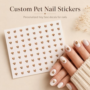 May include: A sheet of custom pet nail stickers featuring repeating tiny face decals of dogs and cats. The text reads Custom Pet Nail Stickers and Personalized tiny face decals for nails. Several fingernails are shown with individual pet face decals.