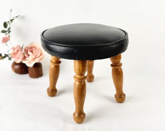 Black Vinyl Vanity Stool | 1950s-1960s Turned Wood Legs Ottoman | Petite Round Vanity Seat