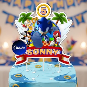 Pode incluir: Um topo de bolo com as personagens Sonic, Tails, Shadow e Knuckles com um número 5 dourado no topo. Uma faixa vermelha no centro exibe o nome SONNY em letras amarelas em negrito, suportado por duas hastes finas de sustentação.