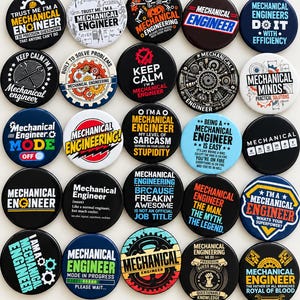 May include: A collection of twenty-five circular pin-back badges featuring various mechanical engineering themes, slogans, and graphics. The designs include text, gears, tools, and illustrations in diverse colour schemes, all arranged in a grid pattern.
