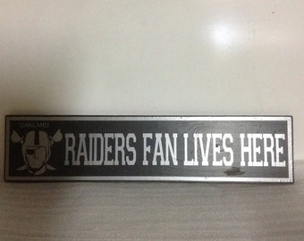 24x6 Fan Lives Here Sign this features our perfect finish with your favorite Sports team!!! Nfl football gift