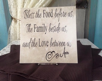 Ceramic Tile with Easel that says bless the food before us the family beside us and the love between us this would make a great gift kitchen