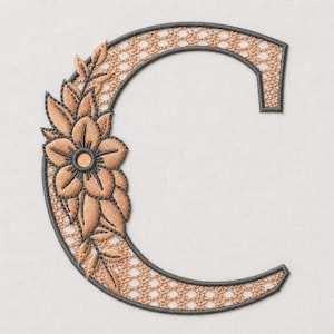 May include: An embroidered letter C featuring a dark gray outline and a light brown lattice fill pattern. The left side of the letter is decorated with a cluster of light brown embroidered flowers and leaves with dark gray stitching details.
