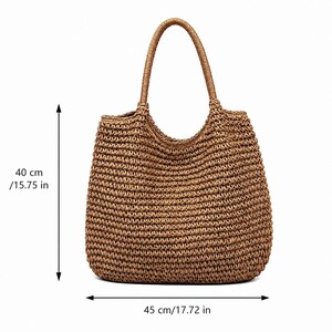 May include: A brown woven straw tote bag with two rounded handles. The bag features a textured, horizontal knit pattern. Dimension markers indicate a height of 40 cm and a width of 45 cm, providing clear scale for this large accessory.