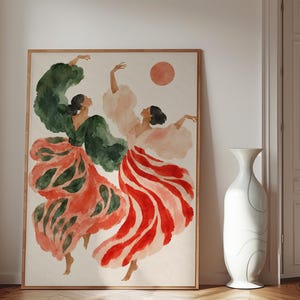Könnte beinhalten: Ein gerahmtes Aquarellbild, das zwei Figuren in Bewegung mit erhobenen Armen zeigt. Eine Figur trägt ein dunkelgrünes Oberteil und einen rot-grün gemusterten Rock. Die andere trägt ein hellrosa Oberteil und einen rot-weiß gestreiften Rock. Eine rote Sonne.