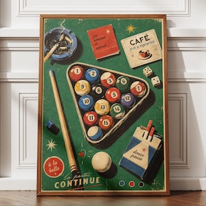 May include: A rectangular poster featuring a green billiard table surface with a triangular rack of numbered pool balls, a cue stick, a cigarette ashtray, dice, a pack of Douce Pause cigarettes, a macaron, and French text including Café, Jeux & Rencontres, and La Partie Continue.
