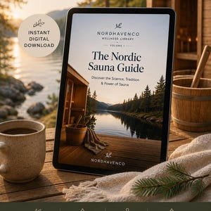 May include: A digital tablet displaying The Nordic Sauna Guide, Volume 1, from the Nordhavenco Wellness Library. The screen shows a lakeside sauna scene. Below, text highlights science-backed information, practical tips, wellness, and tradition.