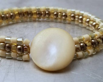 Penzance Bracelet - beadwoven - cream metallic - mother of pearl button