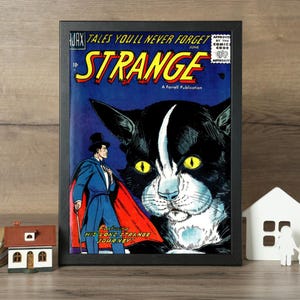 Puede incluir: Una portada de cómic enmarcada titulada Tales You'll Never Forget Strange, que muestra un gato grande en blanco y negro con ojos amarillos y un hombre con traje azul y capa roja. El texto incluye Ajax, June, 10c y A Farrell Publication.